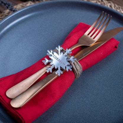 Laser-cut silver mirror snowflake place setting for festive dinner table
