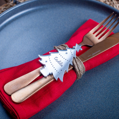 Festive Christmas dinner table decorated with custom silver mirror name place cards