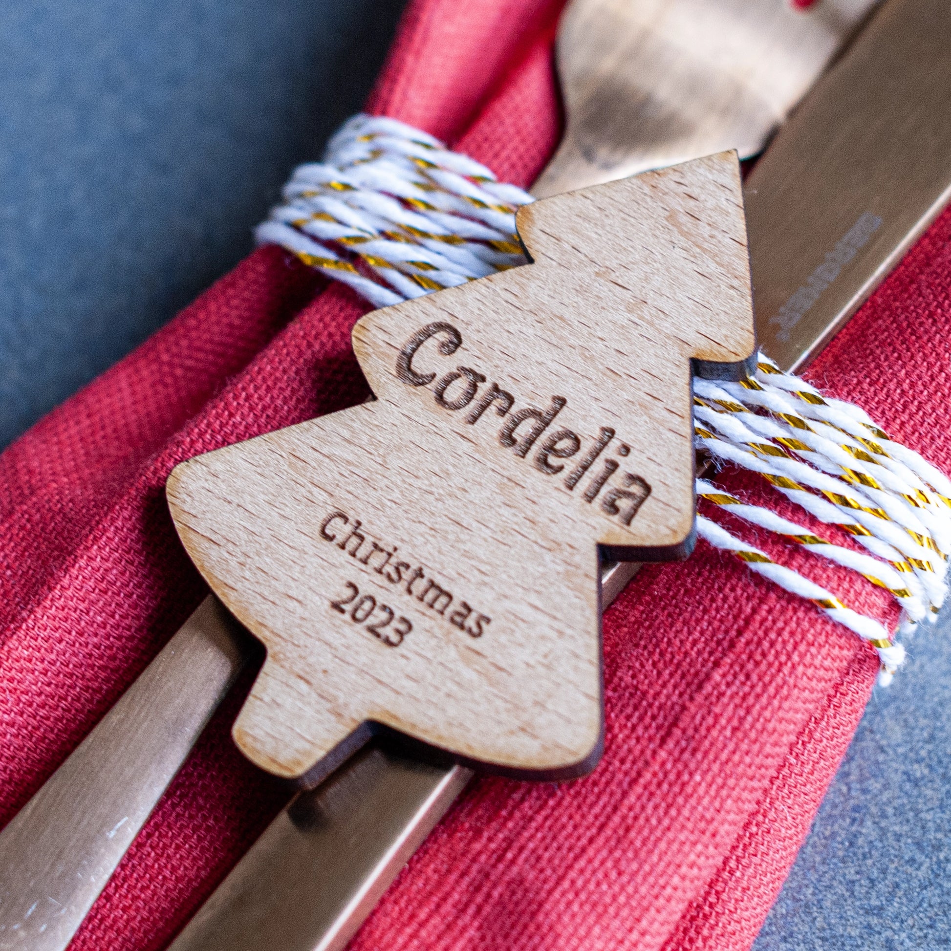 Personalised Christmas tree place setting with child’s name on festive family table