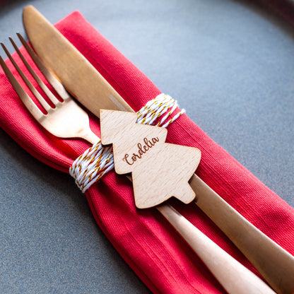 Wooden laser cut Christmas tree name tag on Christmas dinner plate