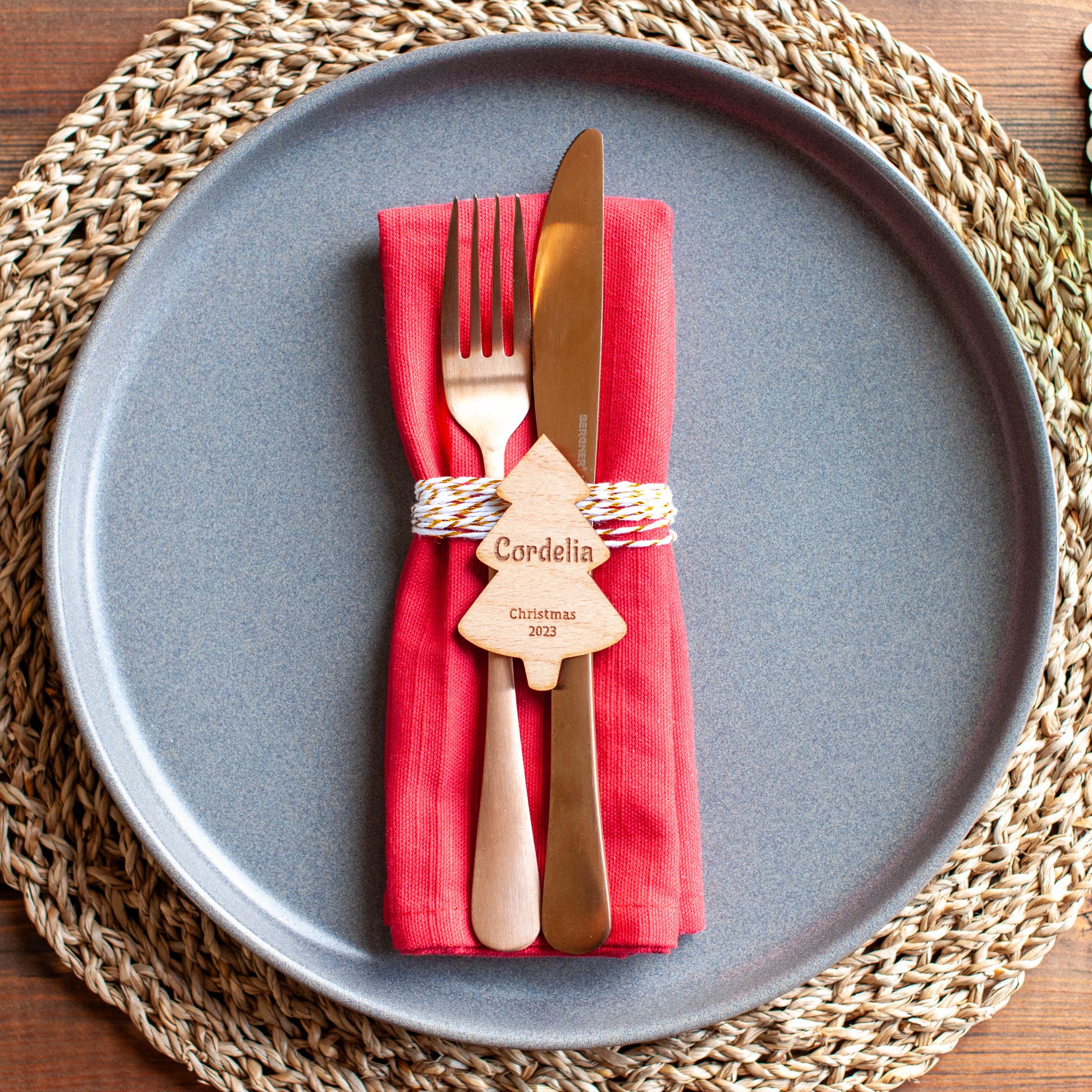 Family Christmas table setup with custom name place settings in tree shape