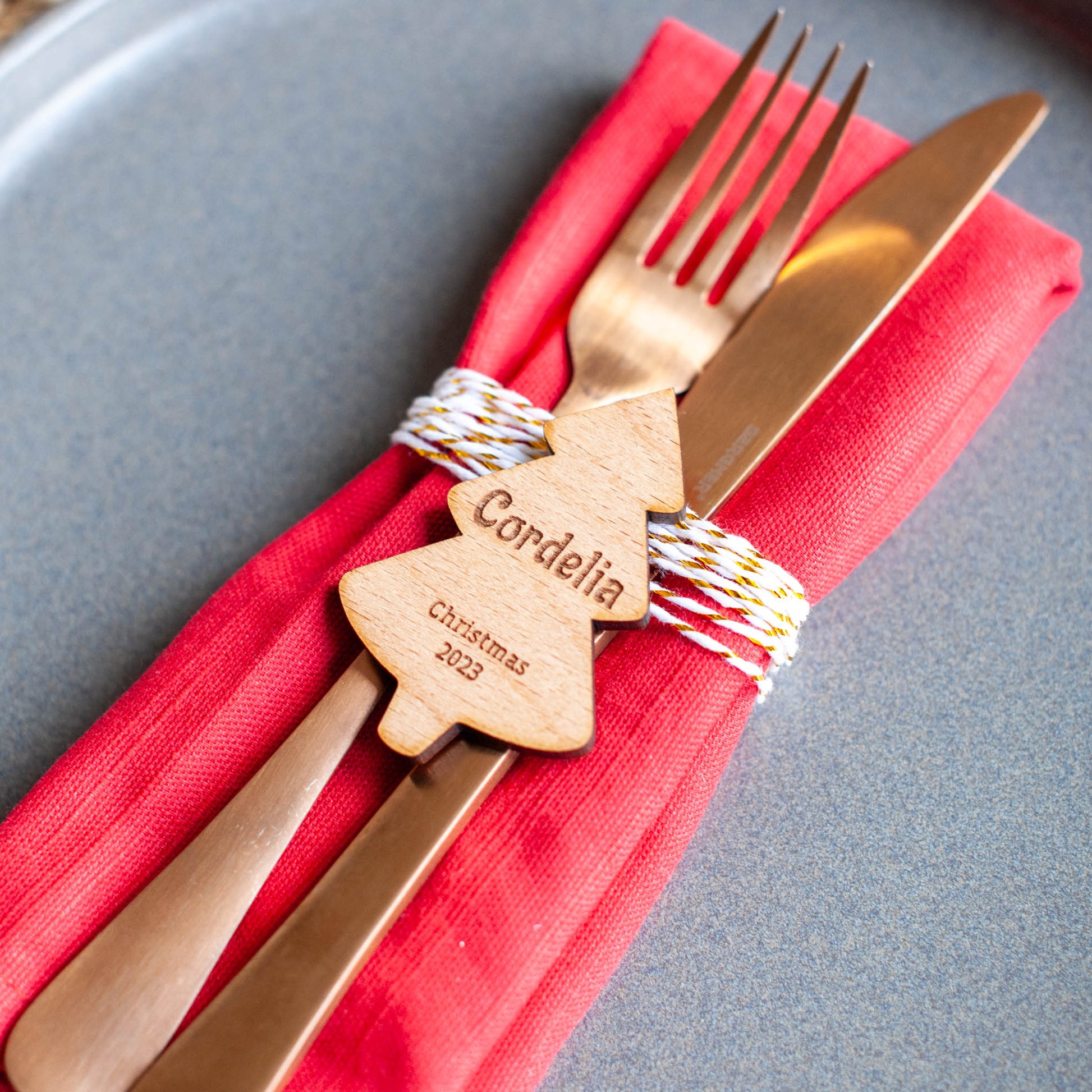Festive holiday table with personalised laser cut Christmas tree décor