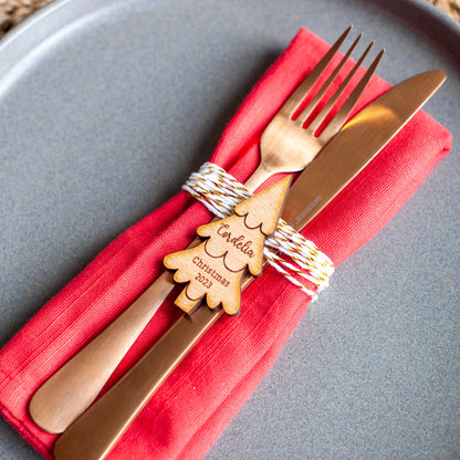 Custom Christmas place card in the shape of a tree for holiday dinner setting