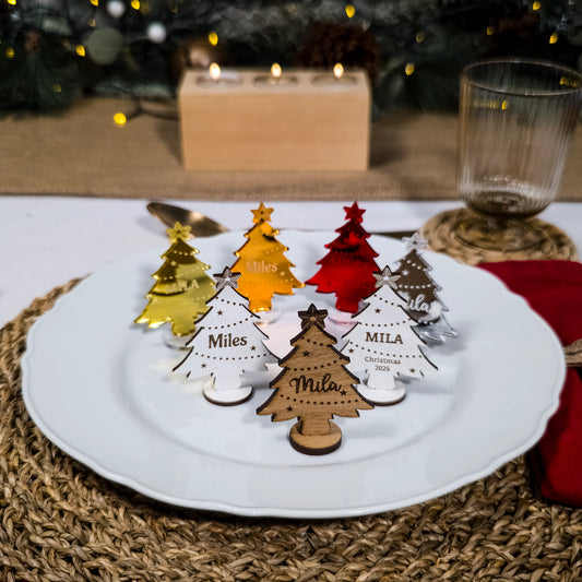 Elegant Christmas table décor with personalised mirror acrylic names and wooden stand alone trees