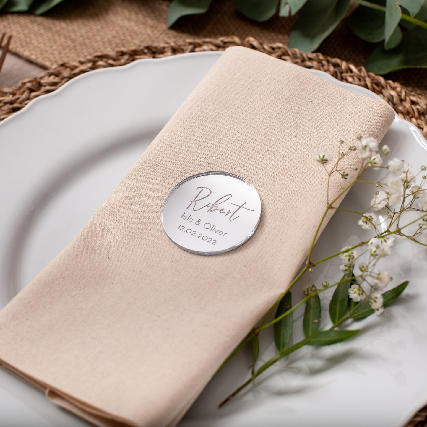 Personalised acrylic circle place card engraved with couple names and wedding date