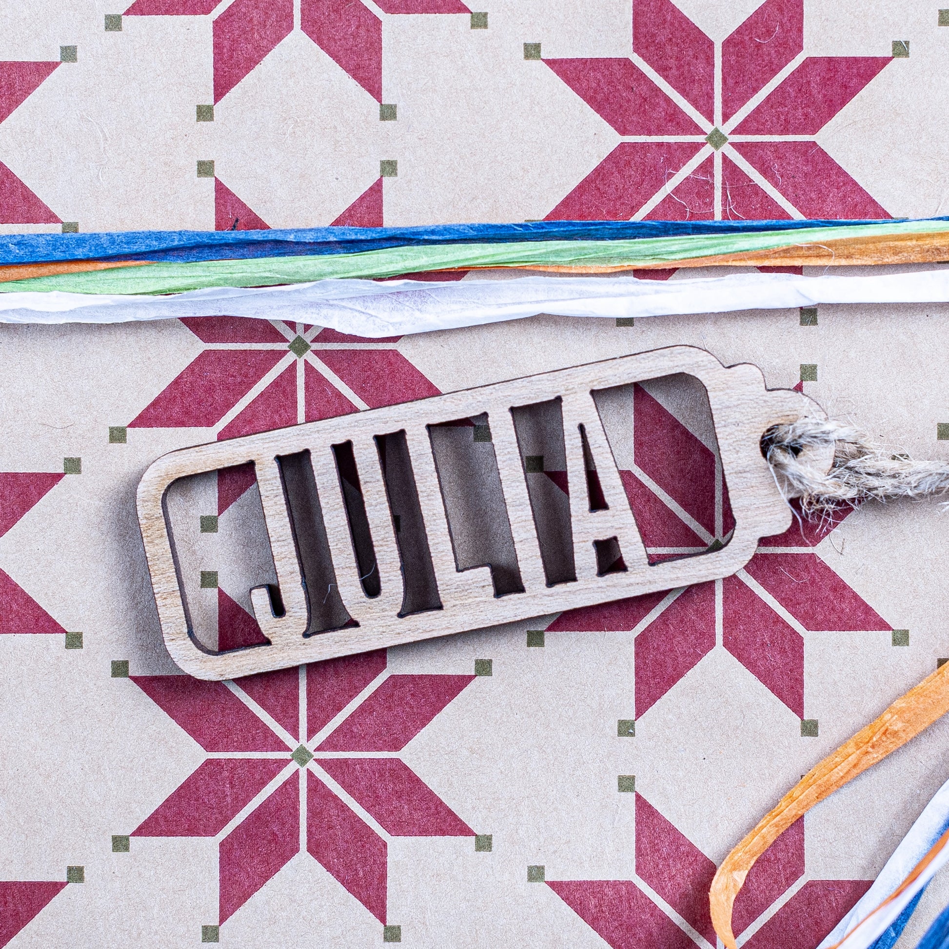 Laser cut name tag made from natural wood for festive gifting