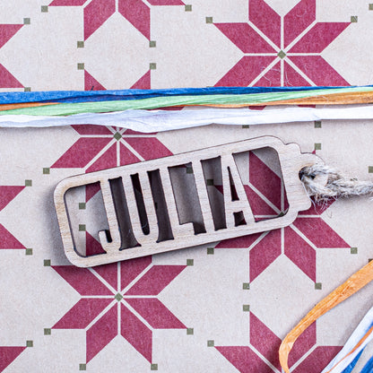 Laser cut name tag made from natural wood for festive gifting