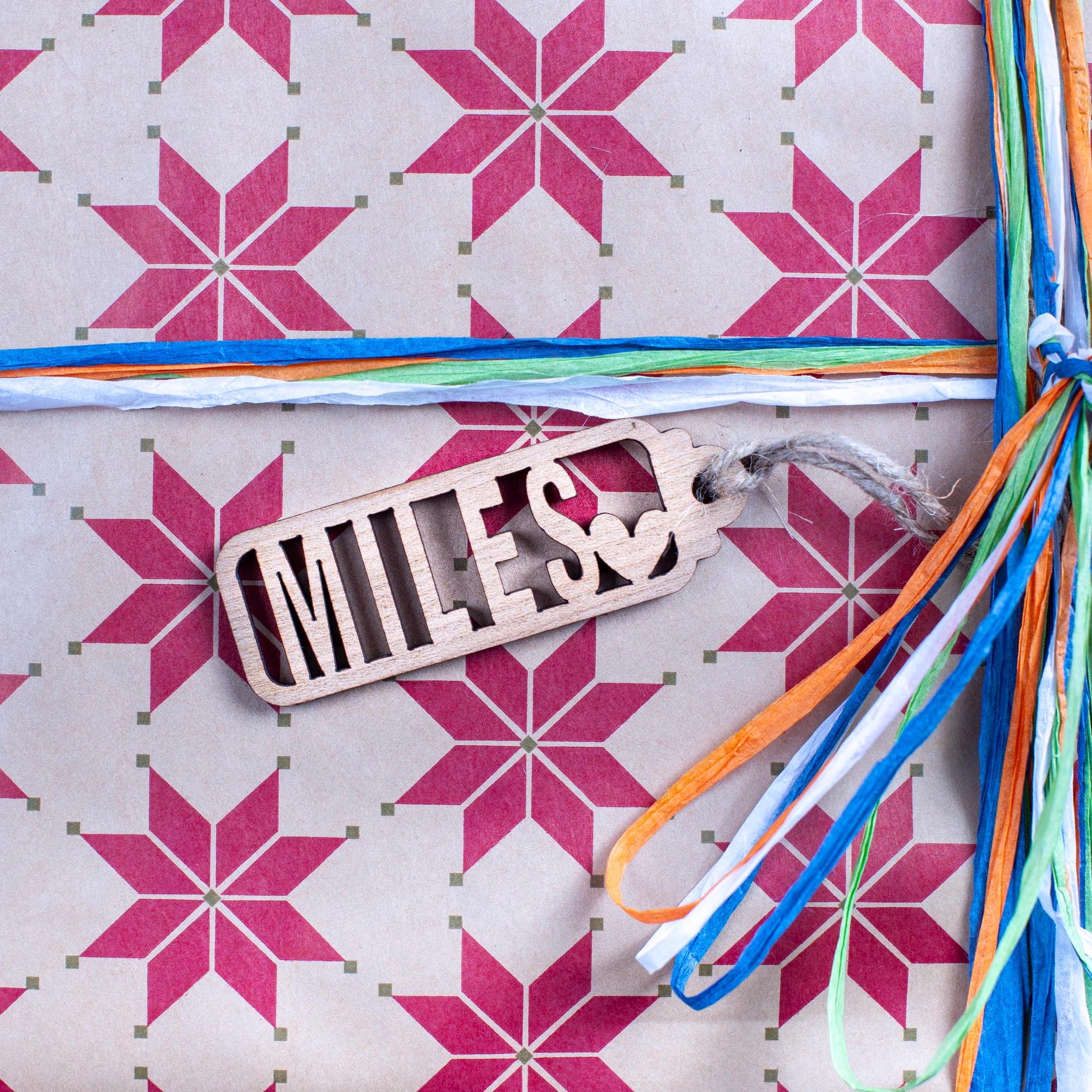 Rustic name cut-out tag in wood for sustainable Christmas wrapping