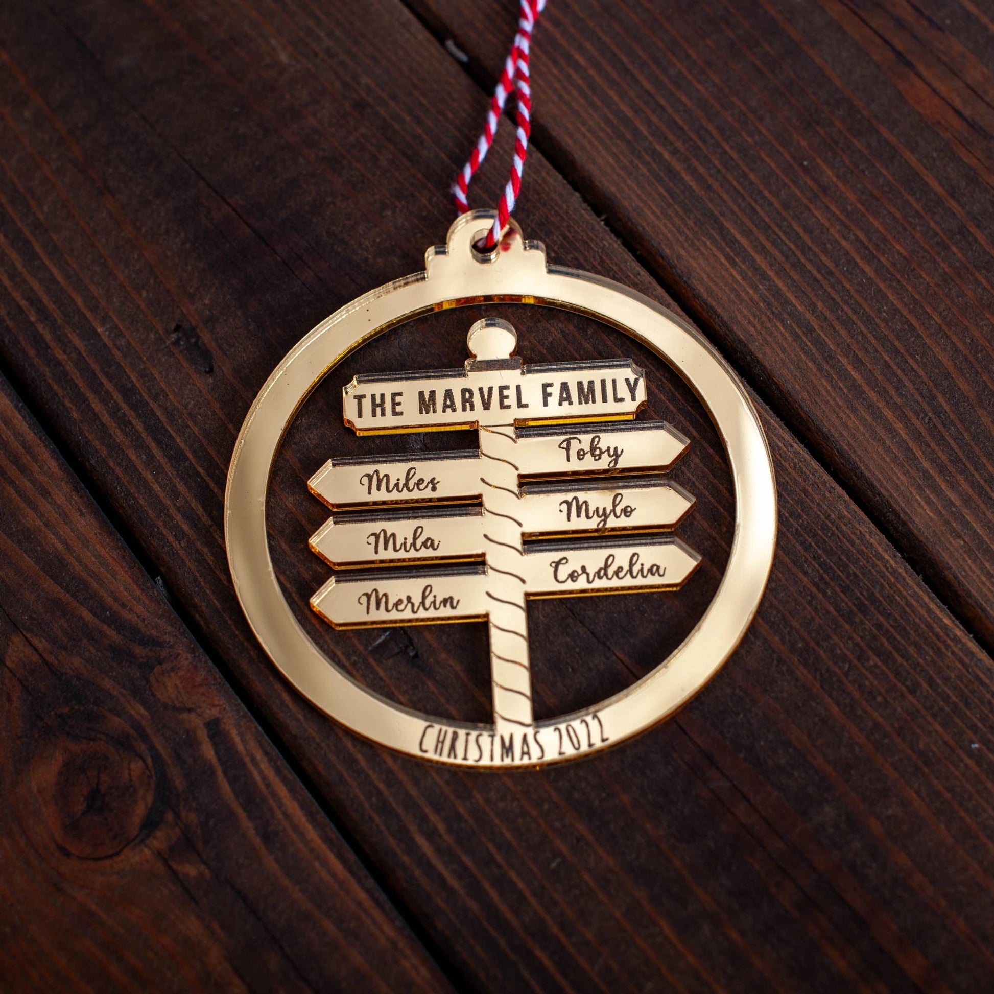 Custom family Christmas bauble engraved with North Pole Post design