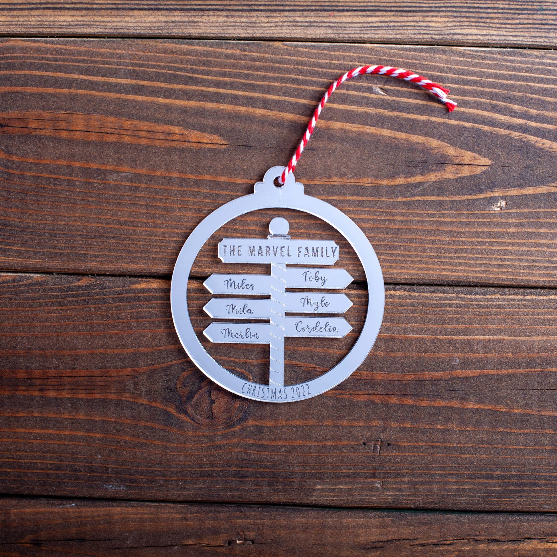 Elegant reflective North Pole Post bauble with custom laser-cut names
