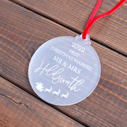 Elegant first Christmas married ornament hanging on tree