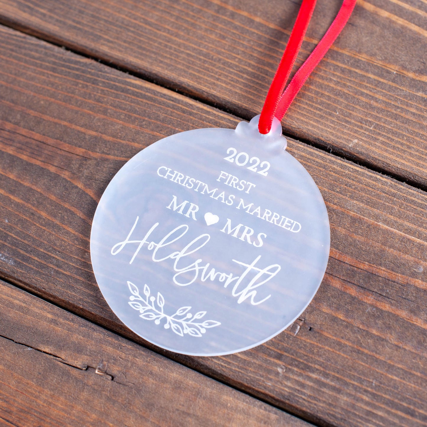 Frosted acrylic decoration with engraved names and heart motif