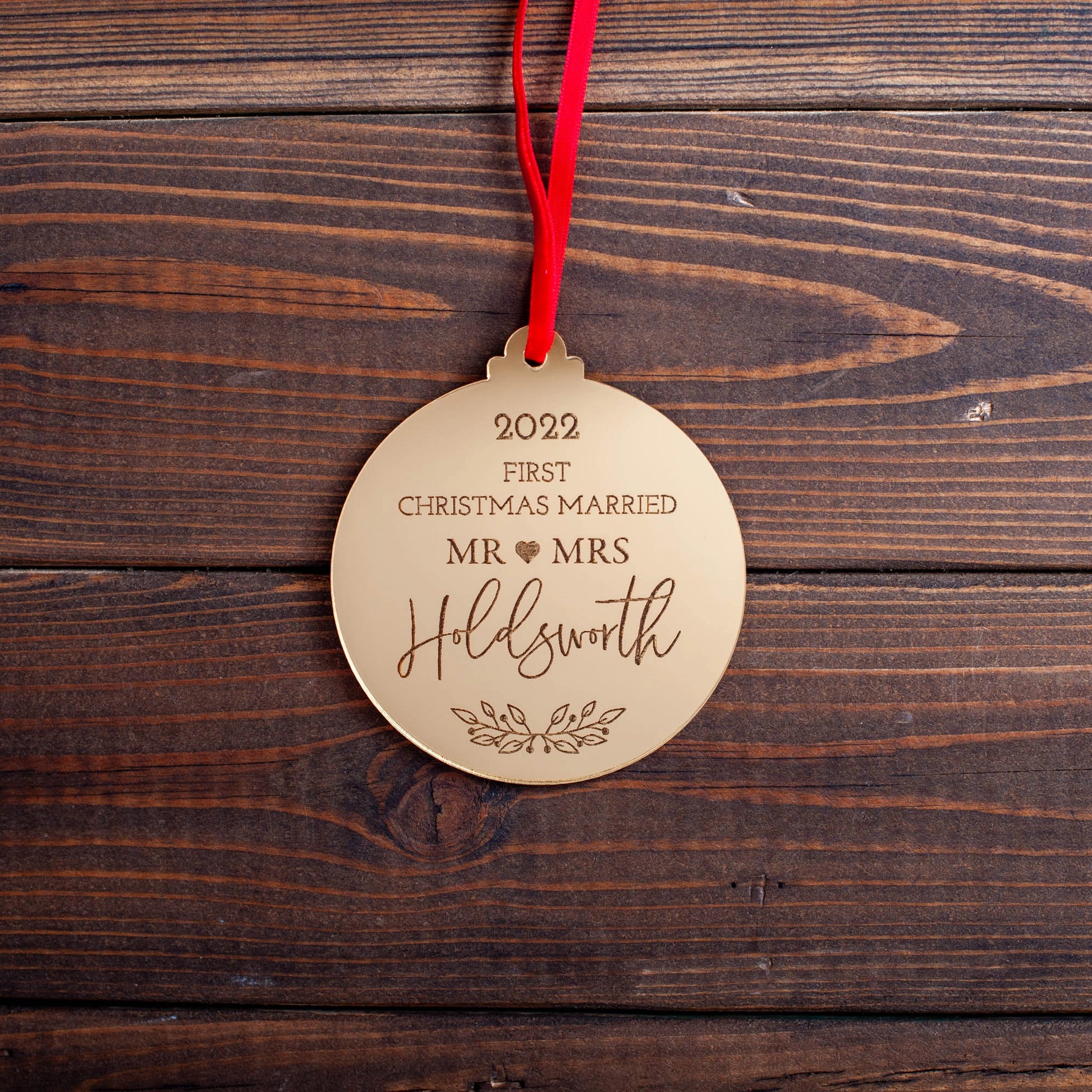 Gold mirror acrylic Christmas bauble engraved with names and date