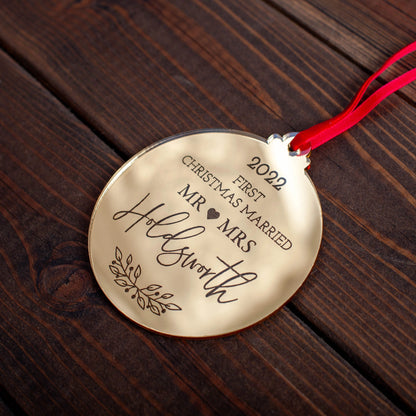 Personalised gold mirror bauble for couple’s first Christmas as newlyweds
