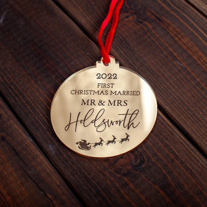 Elegant reflective gold ornament celebrating couple’s first Christmas married