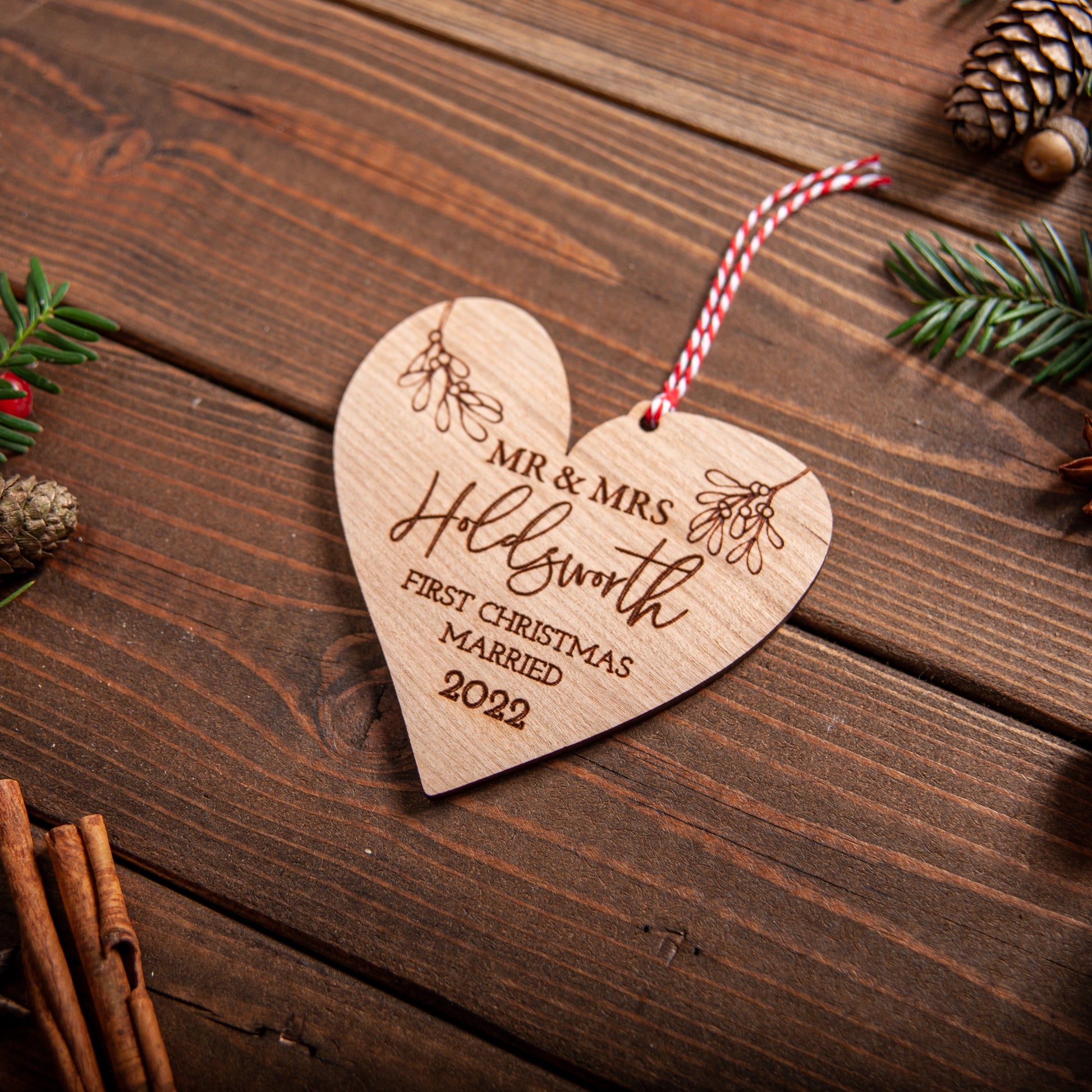 Engraved wooden heart bauble for couple’s Christmas tree decoration