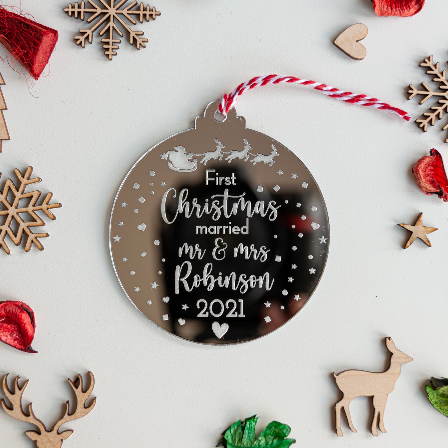 Custom silver mirror acrylic bauble celebrating first Christmas married