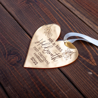 Custom heart-shaped gold acrylic bauble engraved with names and year