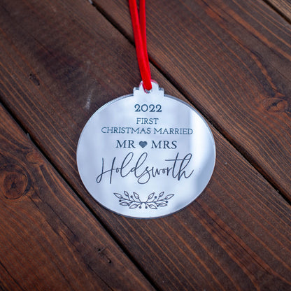 Gold mirror bauble engraved with couple’s names and first Christmas message