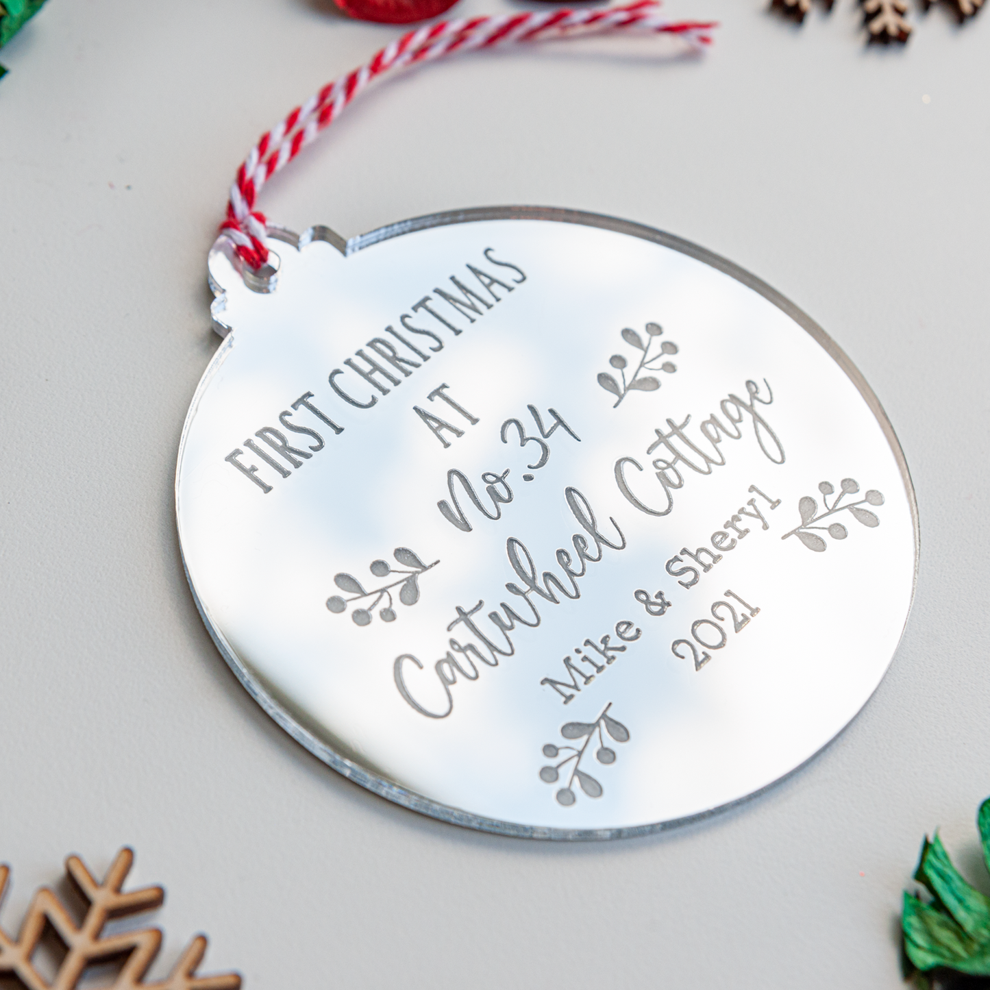 First Christmas in our new home ornament hanging on tree