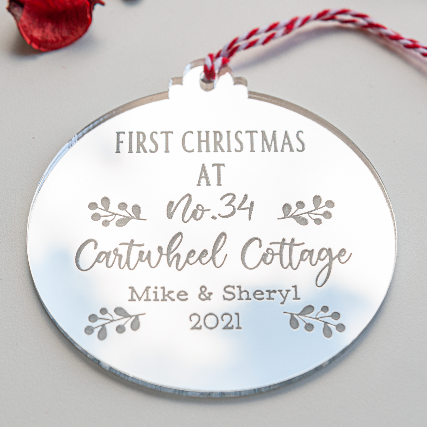 Personalised new home Christmas bauble with couple’s names and year