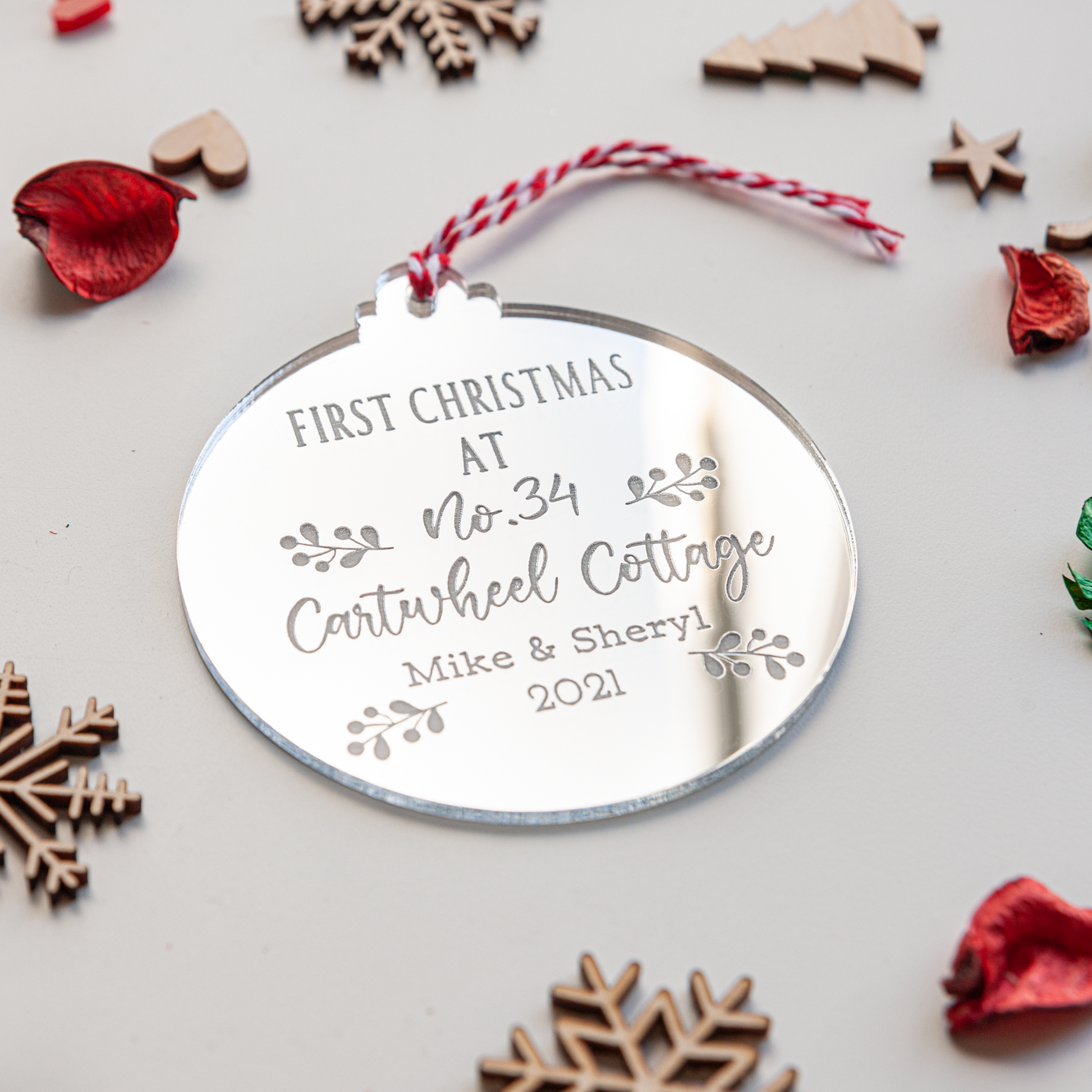 Engraved housewarming bauble with address and ribbon