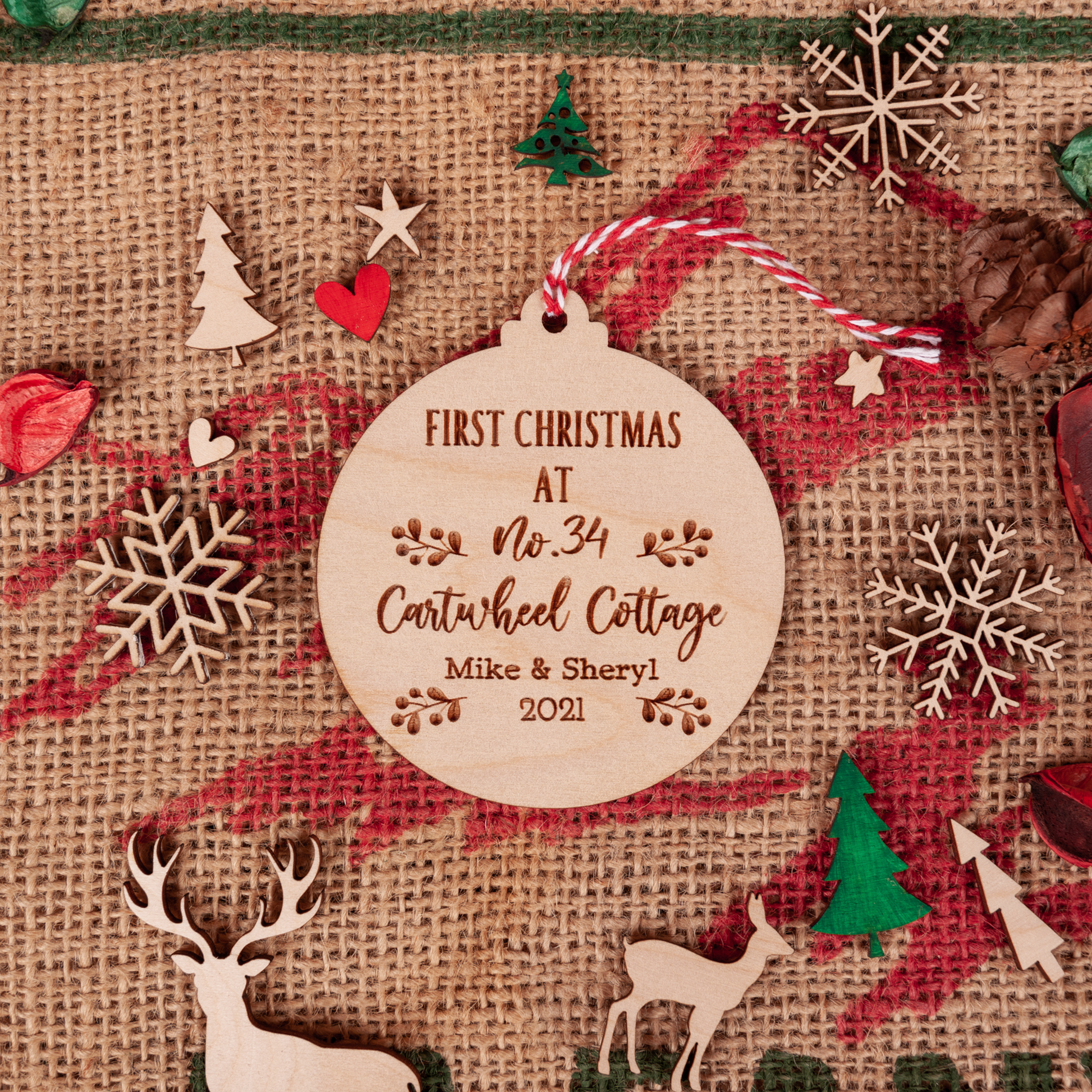 Wooden new home bauble with laser engraving