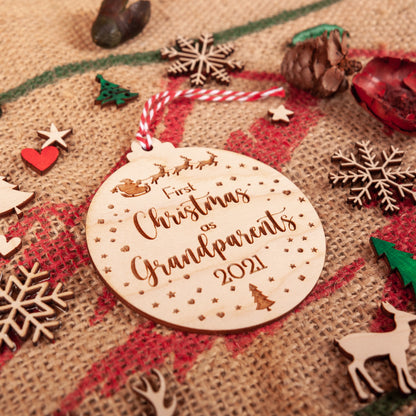 Custom wooden bauble celebrating first Christmas as grandparents
