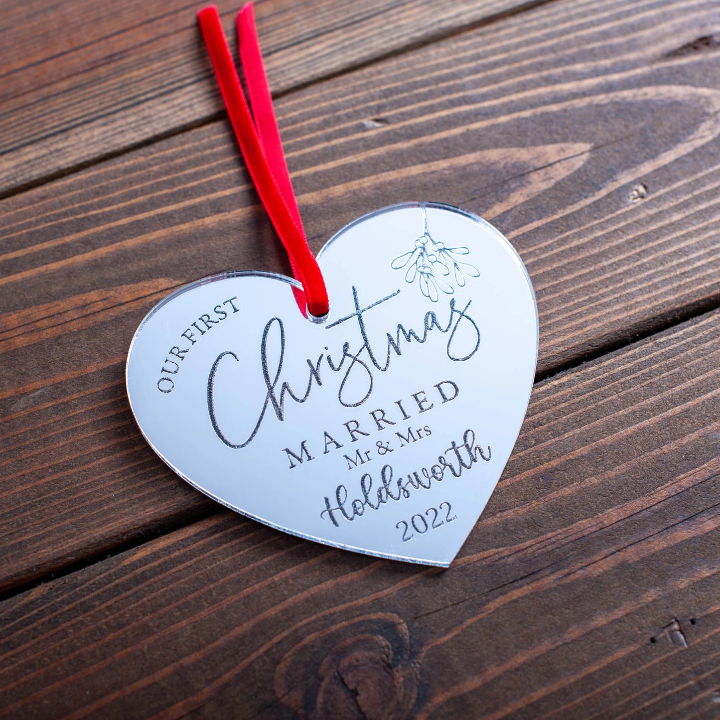 Silver mirror heart bauble engraved with couple’s names and year