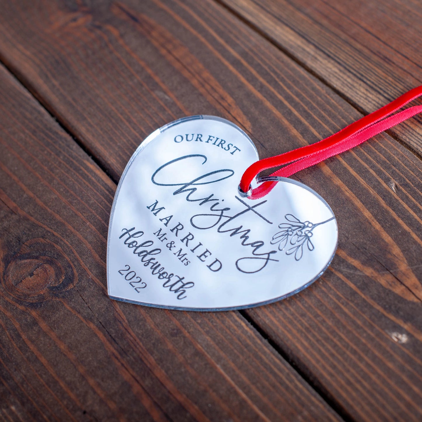 Engraved mirror acrylic heart bauble with Our First Christmas text