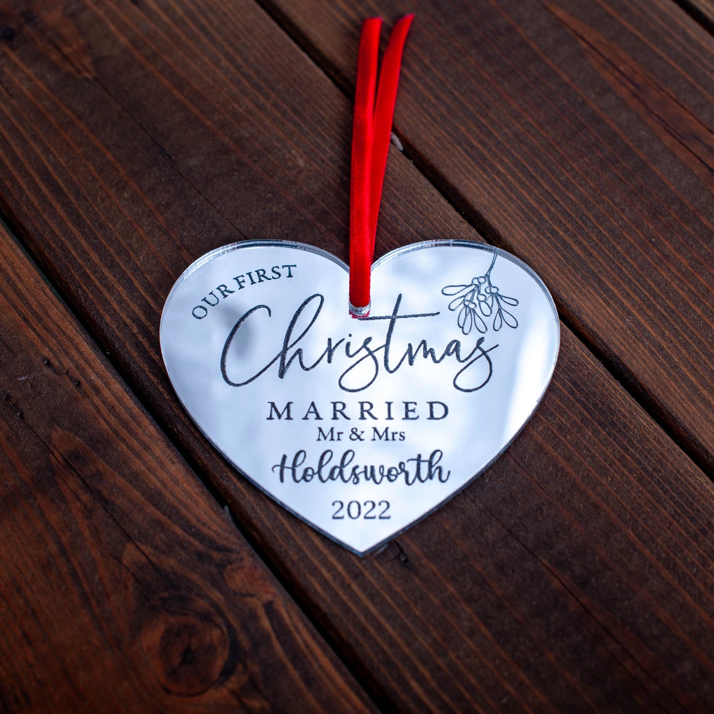 Luxury mirror heart bauble hanging on Christmas tree lights