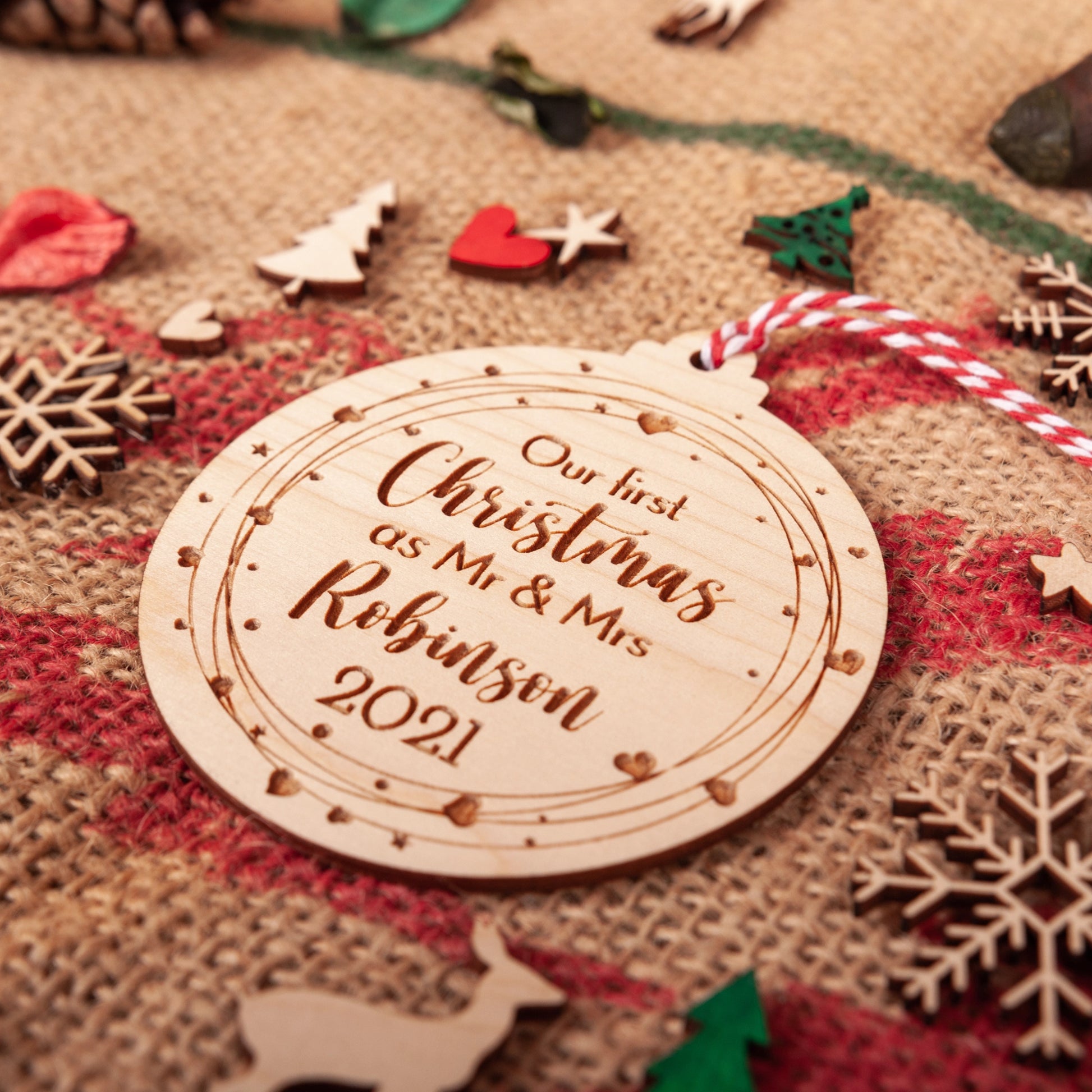 Rustic engraved bauble for first Christmas as Mr and Mrs