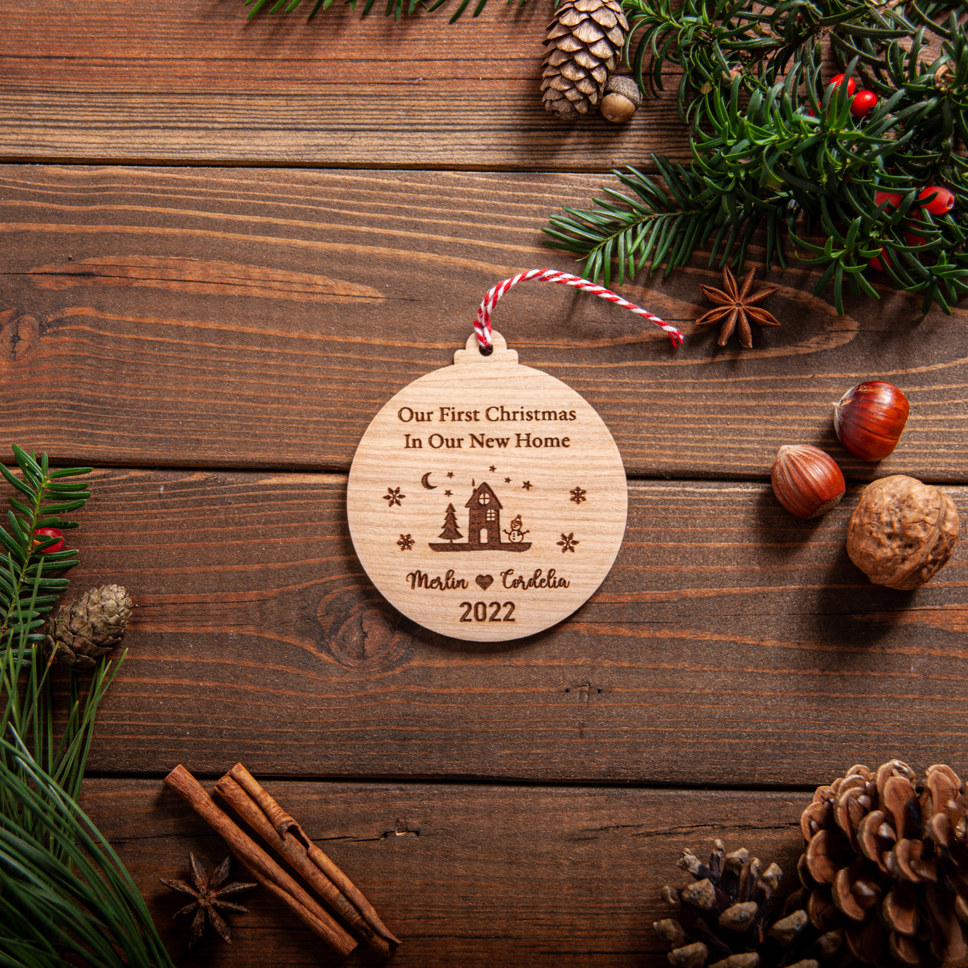 Wooden first home ornament with laser engraving