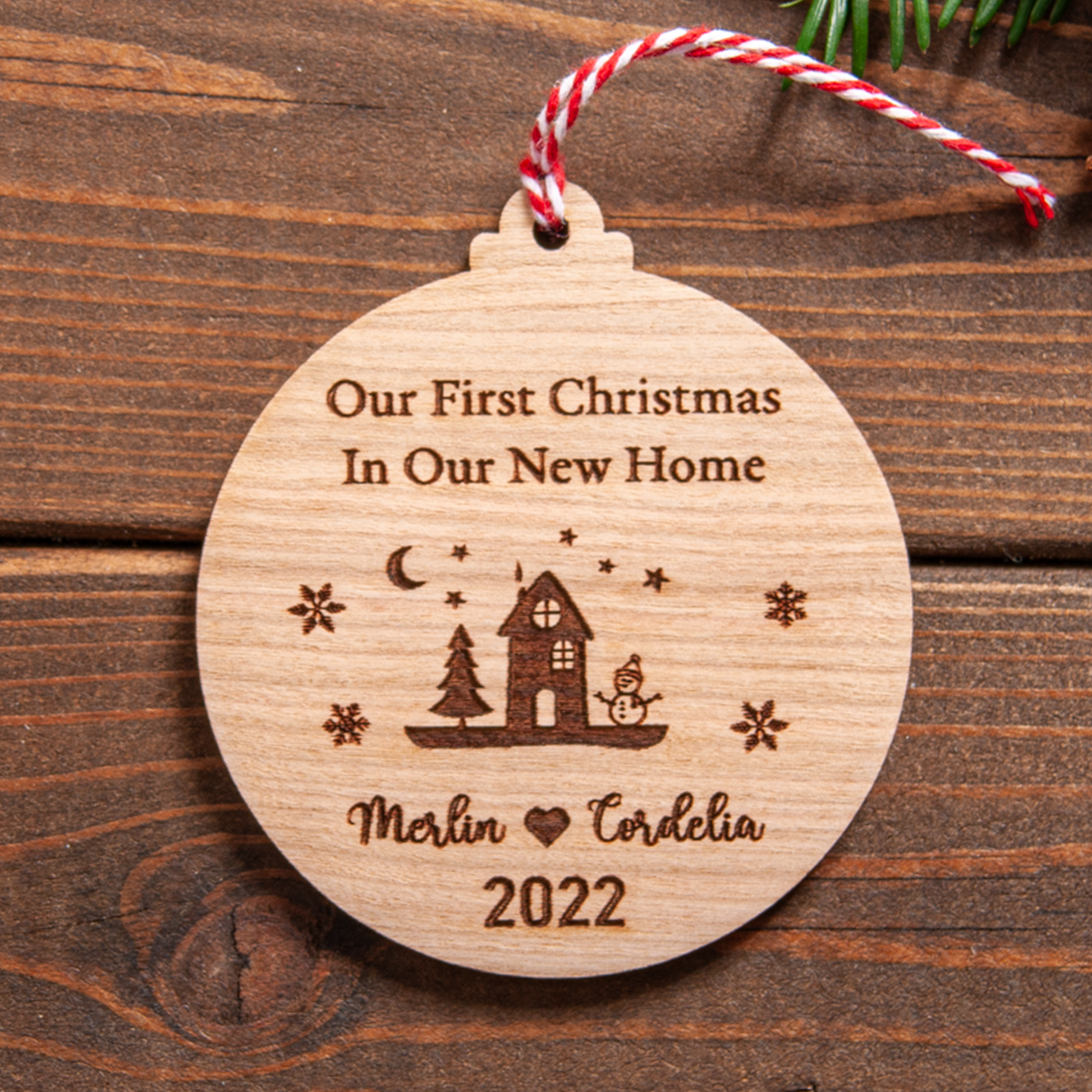 Personalised first home Christmas ornament engraved with couple’s names and year