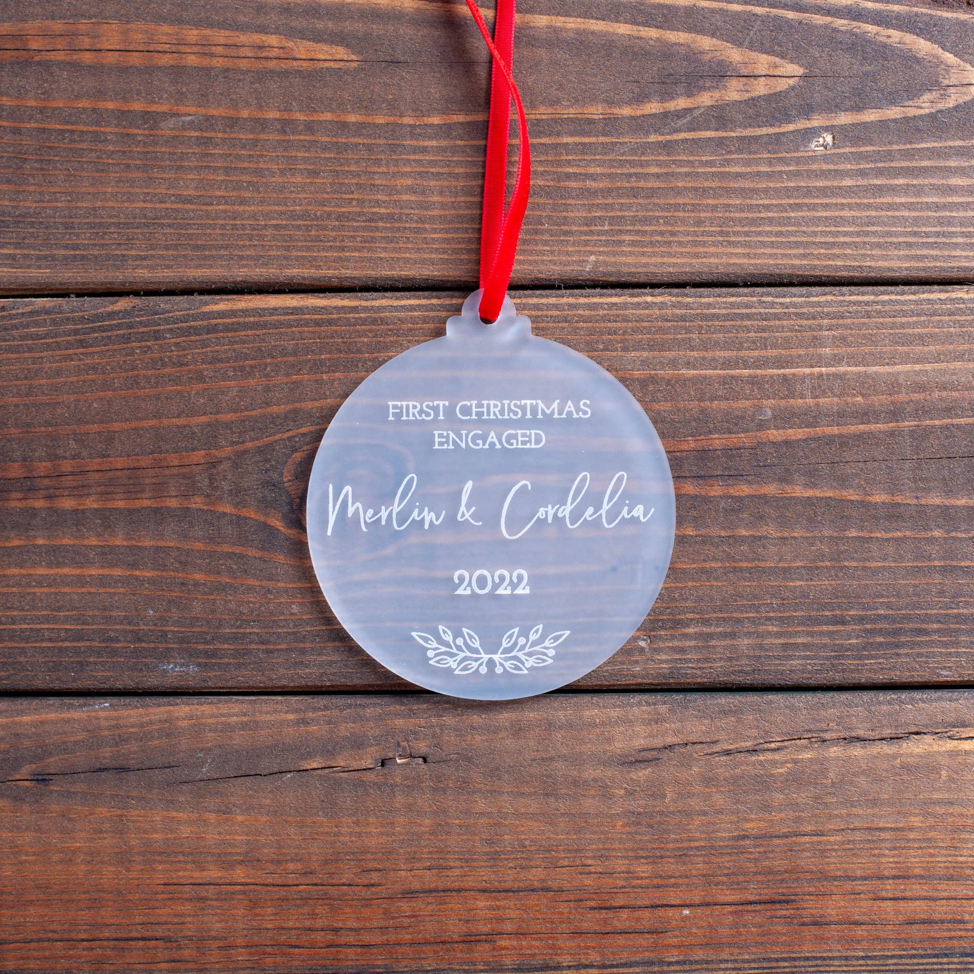 Engraved acrylic wedding keepsake with names and wreath design