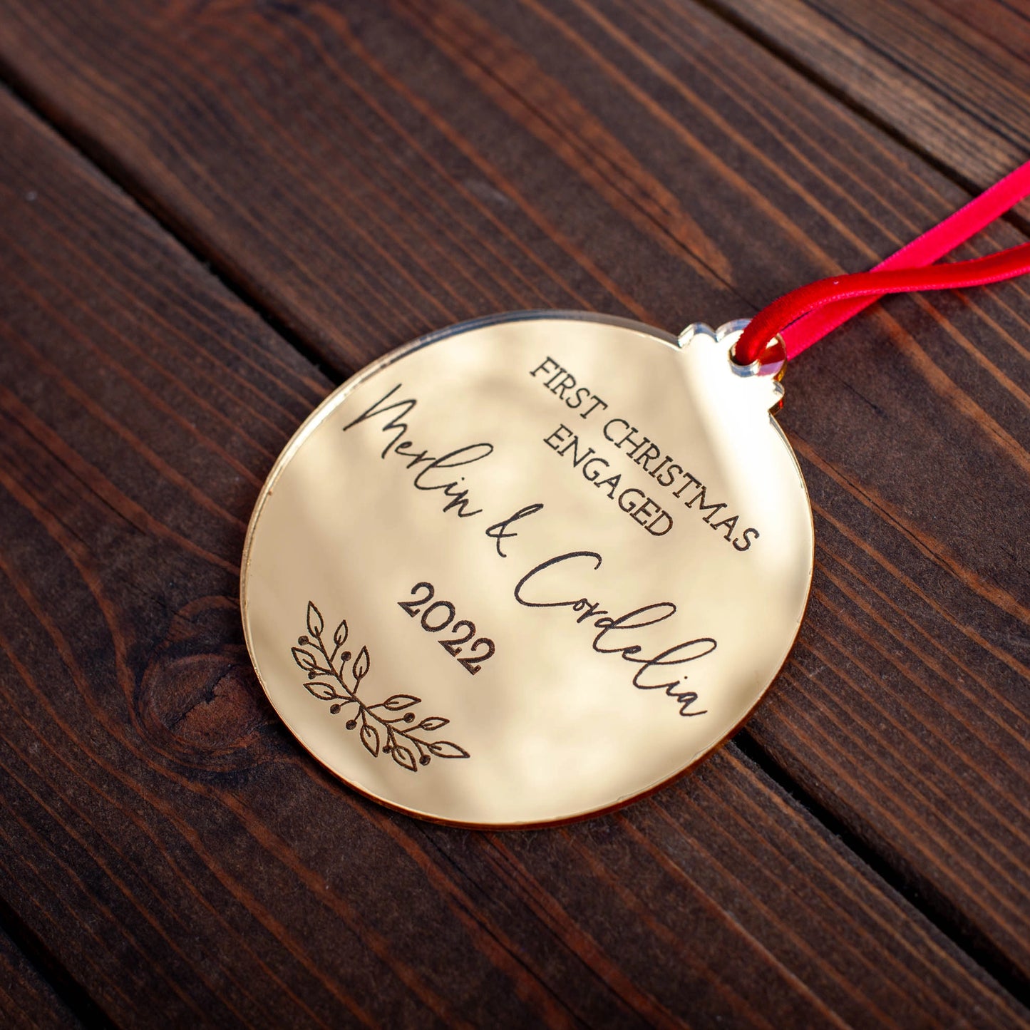 Personalised gold mirror bauble for first Christmas as an engaged couple