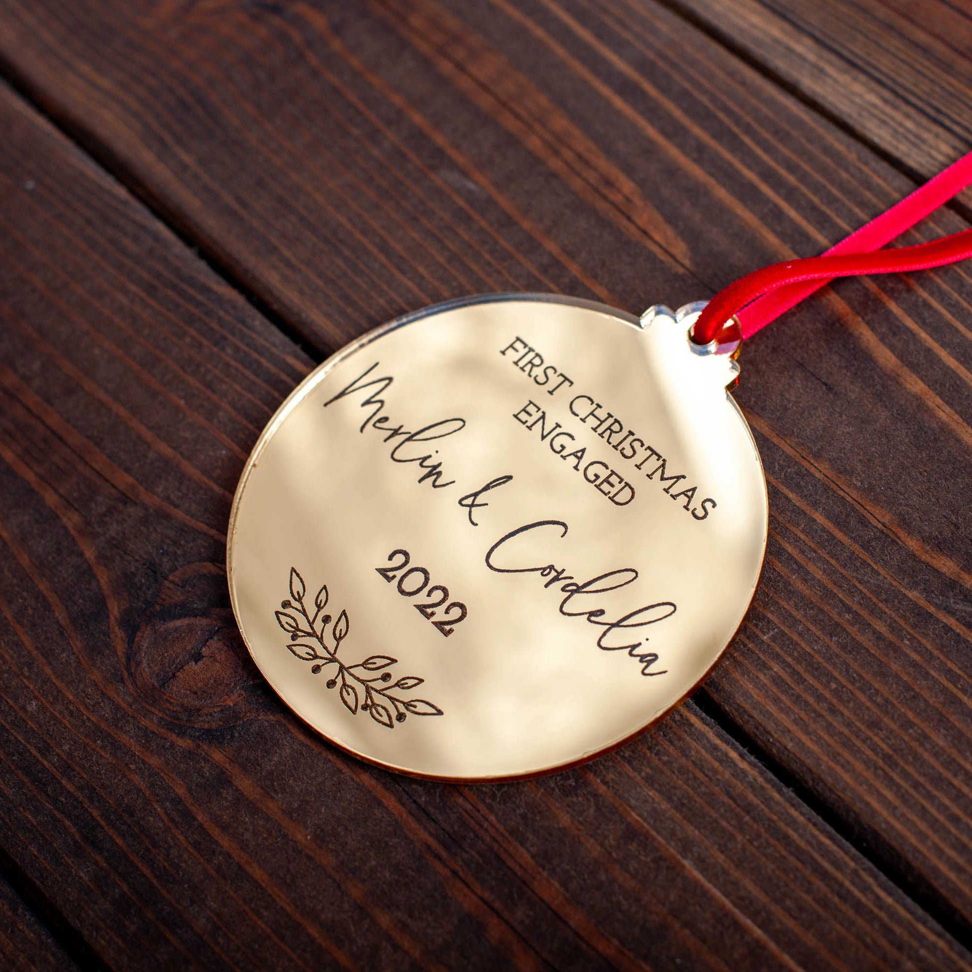 Personalised gold mirror bauble for first Christmas as an engaged couple