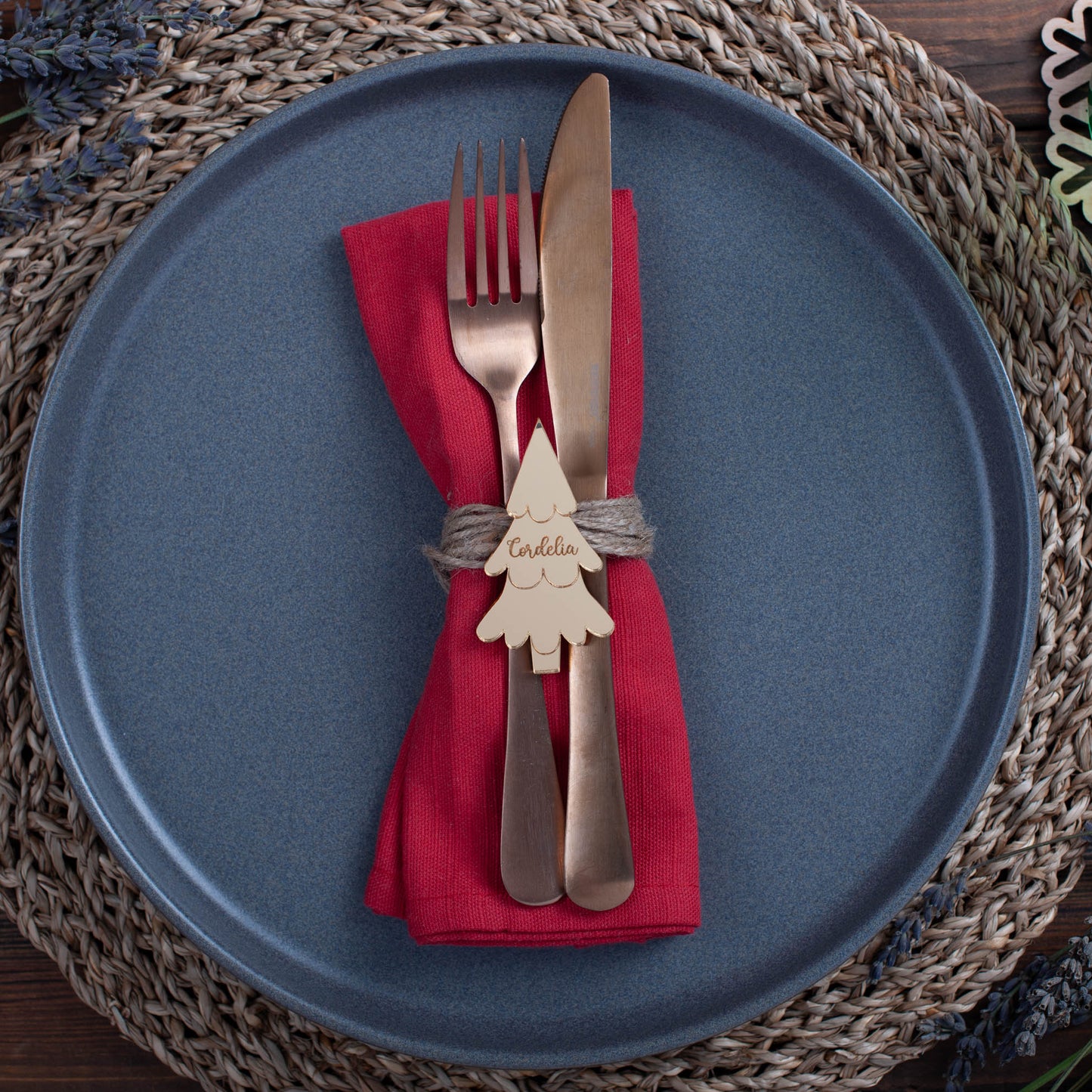 Stylish personalised Christmas tree place card with engraved guest name at luxury winter wedding table