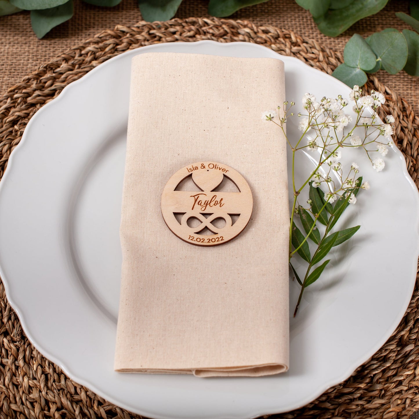 Engraved circle place card with heart and infinity detail for wedding decor