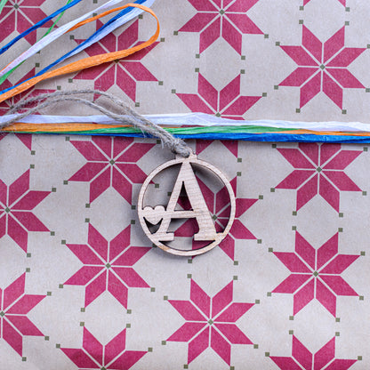 Personalised initial Christmas gift tag made from wood and acrylic