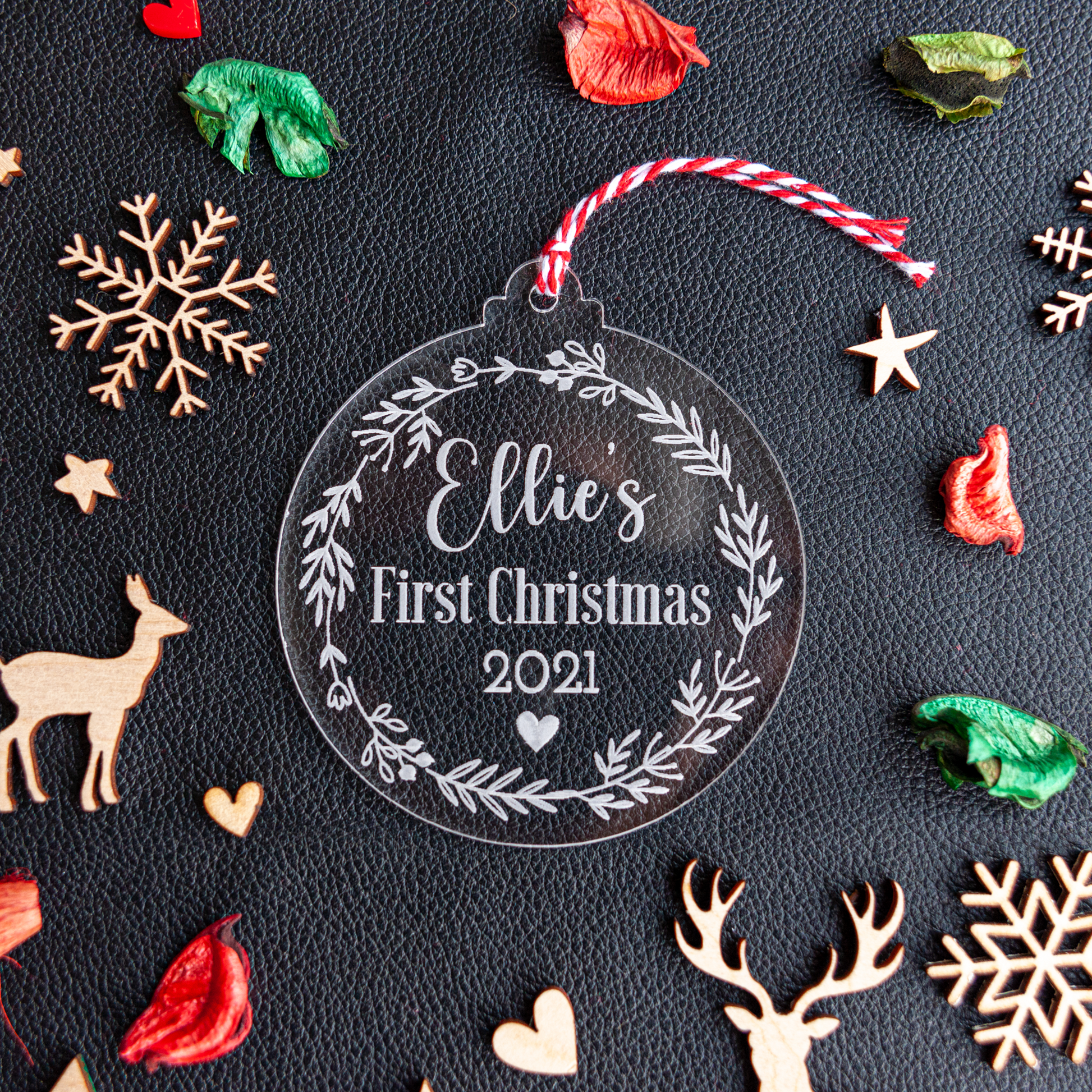 Personalised Baby’s First Christmas acrylic bauble with flower wreath engraving