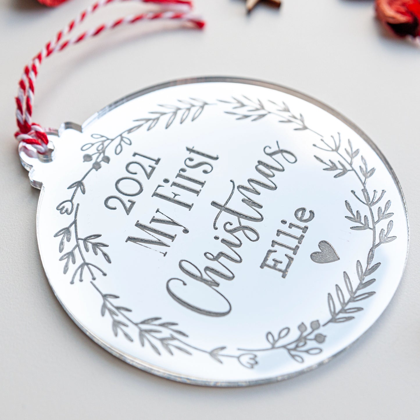 Custom silver mirror bauble engraved with baby’s name and year