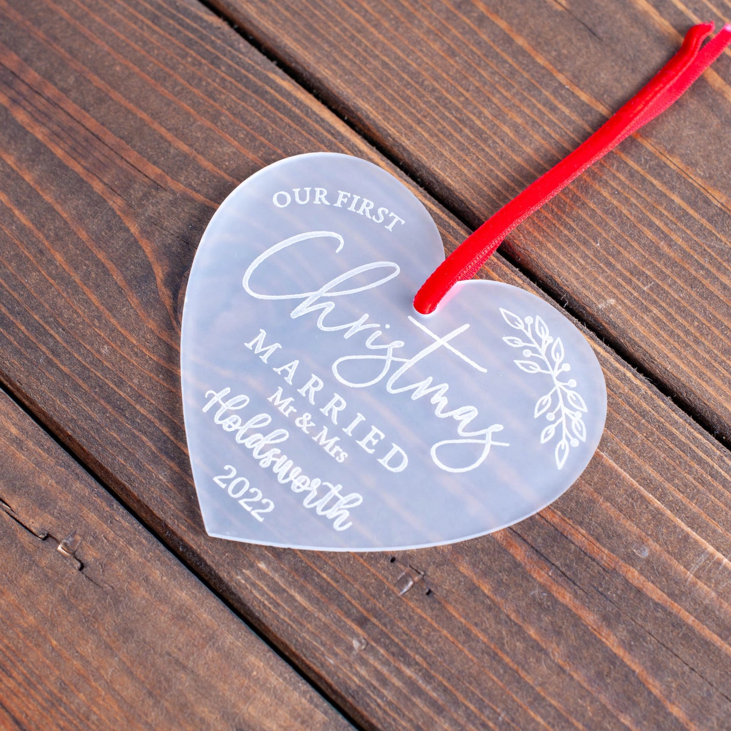 Our first Christmas married personalised frosted ornament on tree