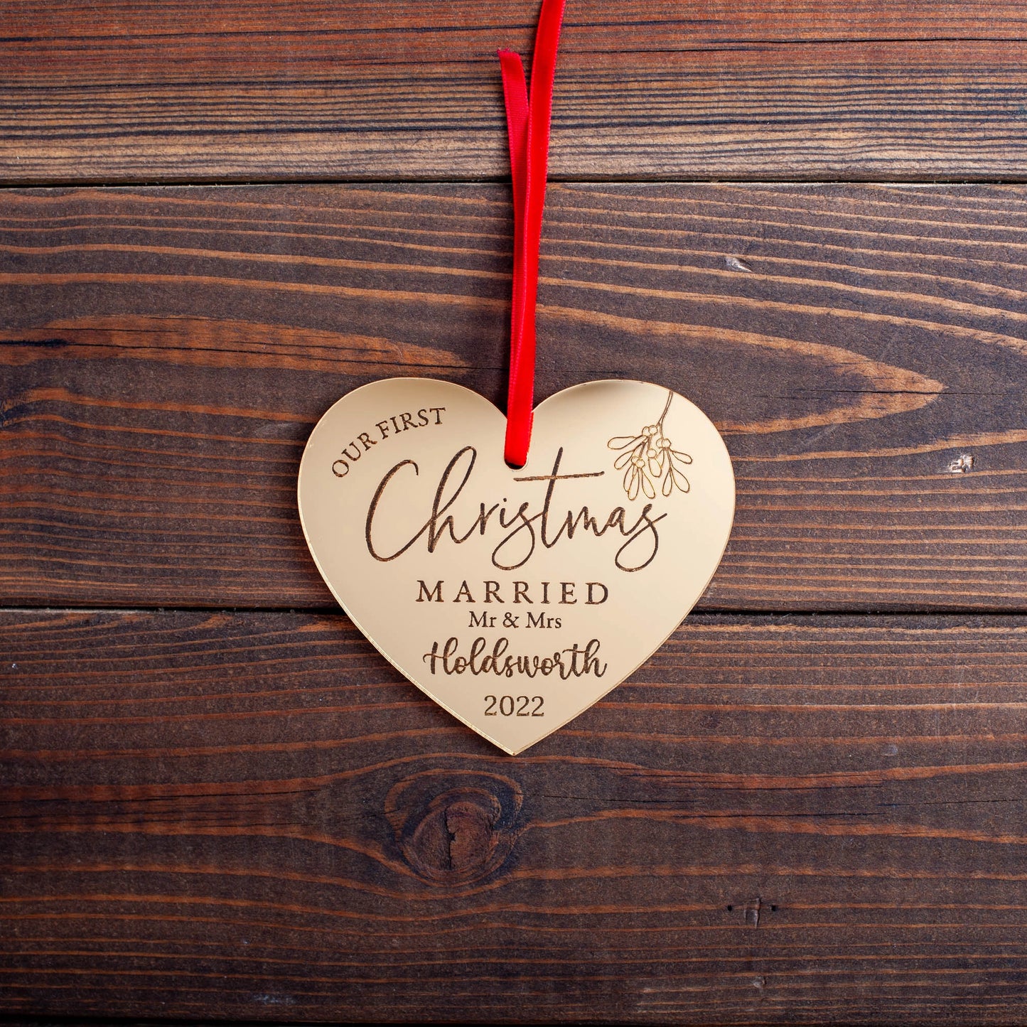 Personalised gold mirror ornament for newlywed couple