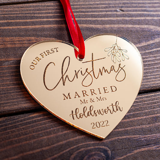 Gold mirror heart bauble engraved with couple’s names and year