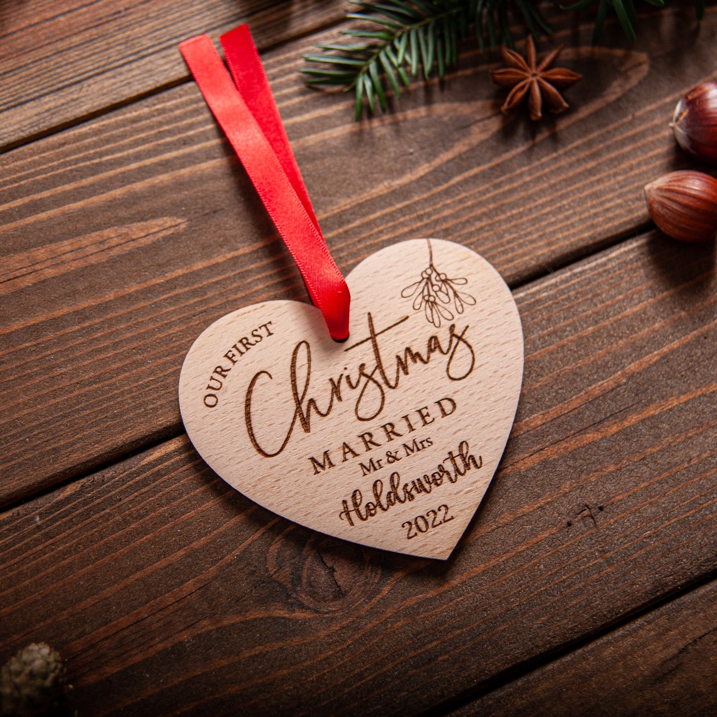 Engraved heart-shaped wooden ornament for couple’s Christmas tree