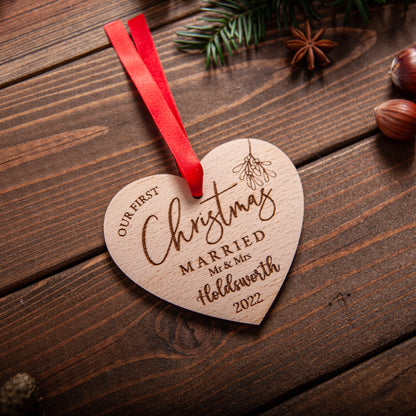 Engraved heart-shaped wooden ornament for couple’s Christmas tree