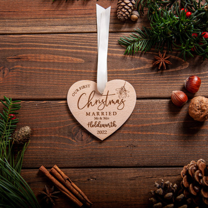 Rustic wooden heart bauble celebrating first married Christmas