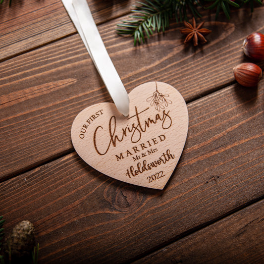 Personalised wooden heart ornament for first Christmas married