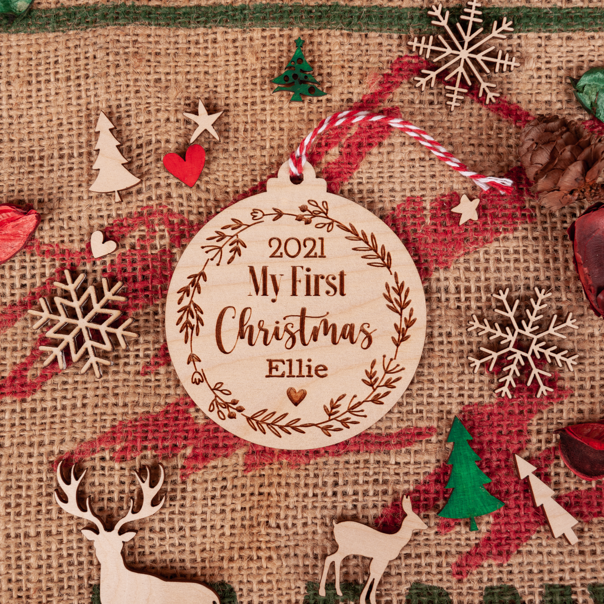 Personalised Baby’s First Christmas engraved wooden bauble with name and year